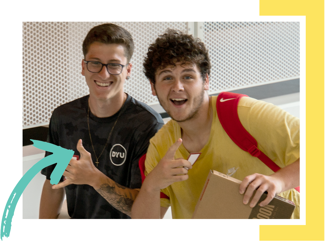 Students smiling at camera.